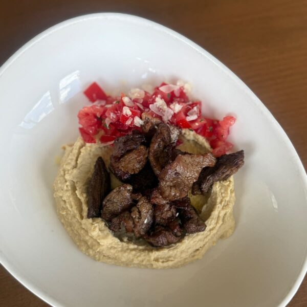 Hummus with beef tenderloin and pomegranate