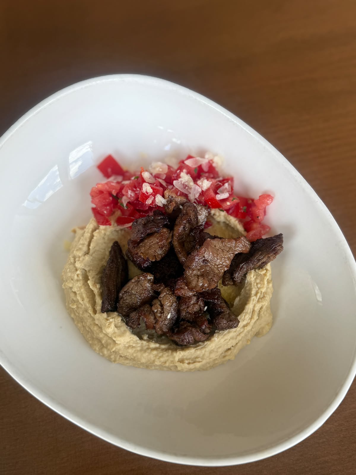 Hummus with beef tenderloin and pomegranate